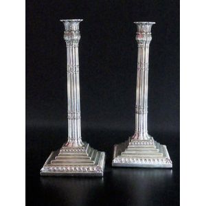 Paired candle sticks in sterling silver these interesting…