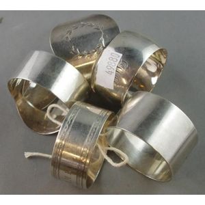 Five sterling silver napkin rings, hallmarked, maker Prouds, 4…