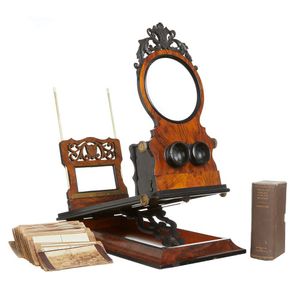 A late Victorian walnut, ebonised and inlaid combined…