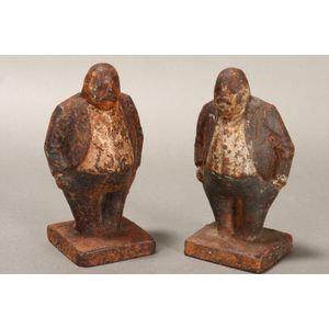 Pair of Victorian cast iron figures, depicting portly men with…