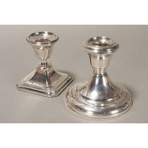 Two sterling silver squat candlesticks, each marked, on a…