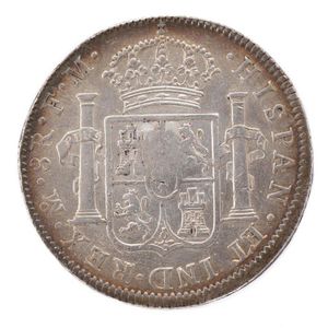 A George III silver emergency coin over strike on Charles IV…