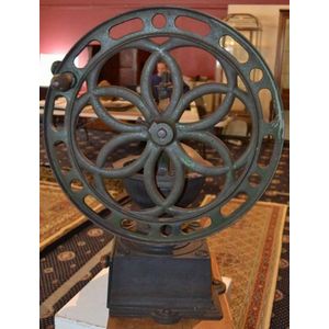 A vintage German cast iron coffee grinder. Height 70 cm