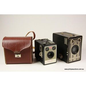 Two vintage Kodak Eastman Brownie box Cameras, a leatherette…