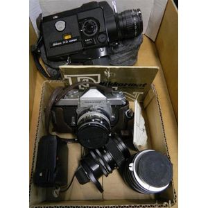 Nikkomat FTN 35 mm camera with with four extra lenses together…