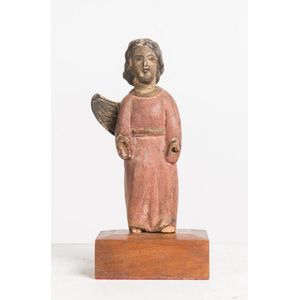 A small naïve wooden carving of a saint, possibly Portuguese,…