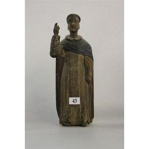 An early 19th century Santos, carved as a Saint. Height 27 cm