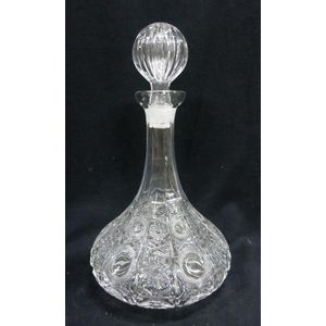 A pressed glass ship's decanter, with flower pattern detail,…