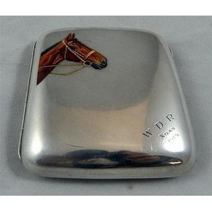 A sterling silver cigarette case hallmarked Birmingham. Front…
