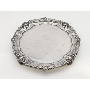 Sterling silver salver, decorated with embossed floral feet,…