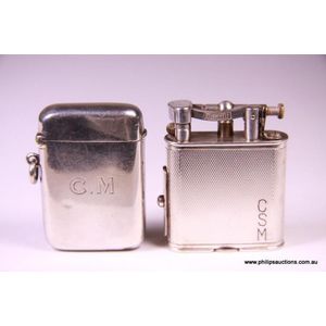 A Dunhill pipe lighter and a sterling silver vesta case, circa…