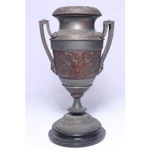 A Grecian style urn on marble base with a coppered central…