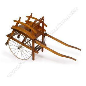 An antique French child's dog cart, the fruitwood cart with…