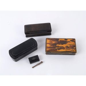 Three snuff boxes, two black papier mache and one horn and…