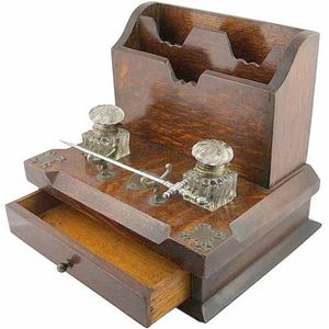 Victorian oak desk tidy with a single drawer, two inkwells & an…