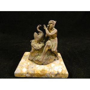 A gilt bronze 'Leda nd the swan' inkwell on terrazzo base