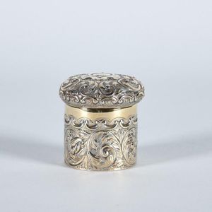 A Victorian sterling silver dressing table box, ornately…