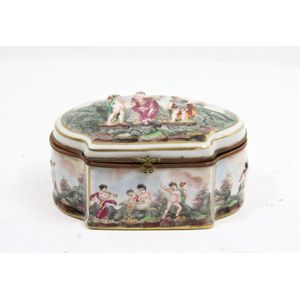 A Naples porcelain cherub decorated jewel casket. 8 cm high, 16…
