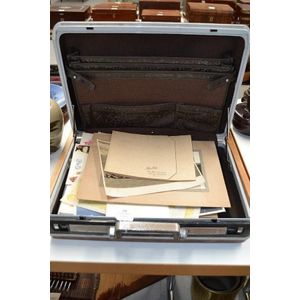Vintage suitcase with various war and travel related documents