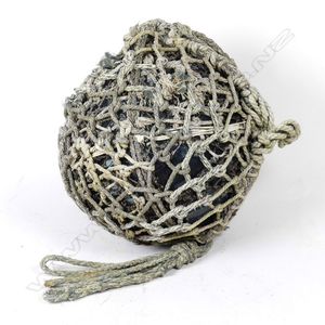 A large glass fishing float, in two layers of netting, diameter…