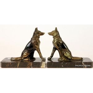 A pair of Art Deco Alsatian bookends, circa 1930s, the opposite…