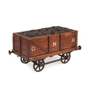 A rare cigar box in the form of a coal carriage, English 19th…
