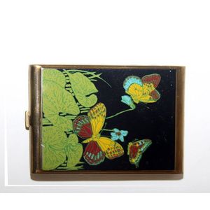 An Art Deco cigarette case with enamelled decorated with…