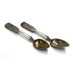 Two silver metal teaspoons, black floral detail with unverified…