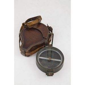 Vintage bronzed prismatic compass with original leather case,…
