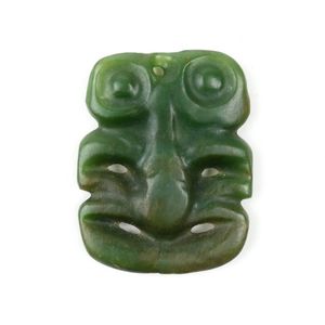A pre-European Maori pounamu hei tiki, of small rounded…