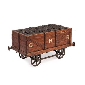 A rare cigar box in the form of a coal carriage, English 19th…