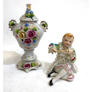 A ceramic figure of a flute player & a lidded comport, height…