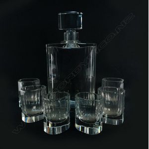 An Art Deco facetted clear glass decanter and six glass set,…