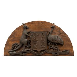 An Australian coat of arms, cast bronze mounted on timber panel,…