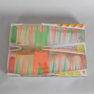 A Karim Rashid backgammon set, with translucent dice,…