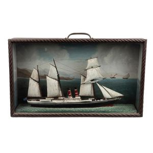 An antique maritime diorama, sail steamship model housed in…