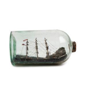 An antique ship in a bottle with coastal scene diorama, 19th…