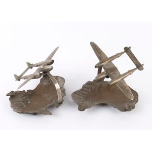 Two World War II period chrome aeroplane ashtray ornaments with…
