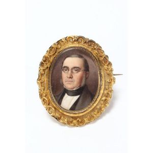 Portrait miniature set into a gilt metal oval brooch mount,…