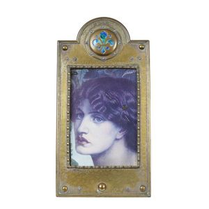 Two late Victorian brass frames, a Liberty style hammered brass…