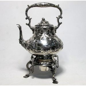 A Roberts and Belk Victorian silver plate tea kettle on burner…