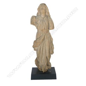 An attractively weathered carved wood statuette of a saint,…