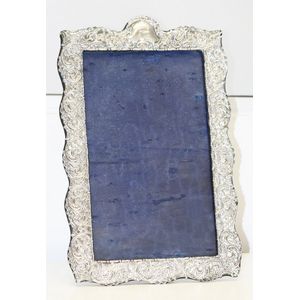 A sterling silver frame, monogrammed 'HH', William Farmer & Co.…