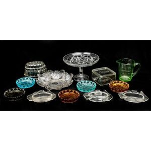 A collection of pressed and coloured glass dishes, bowls and…