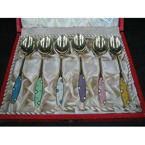 Six Danish translucent enamel and silver-gilt coffee spoons;…