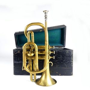 A brass piccolo trumpet, in case, with three separate lead…
