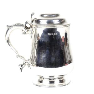 A Victorian lidded tankard, plain baluster form on round…
