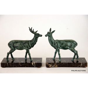 A pair of spelter deer and stag bookends, circa 1930, the…