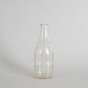 A vintage Mobil Oil bottle, cast glass with raised text that…