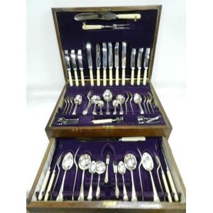 A timber canteen of silver plate Xylonite handled cutlery,…